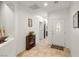 Bright, spacious hallway with tiled floors and decorative accents leading to other parts of the home at 4459 Lavender, Pahrump, NV 89061
