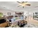 An open-concept living room showcases modern finishes, a ceiling fan, and plenty of natural light at 4459 Lavender, Pahrump, NV 89061