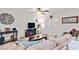 Cozy living room boasts a ceiling fan, comfortable sofa, and decorative fireplace at 4459 Lavender, Pahrump, NV 89061