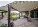 A covered patio overlooking the lush backyard at 4509 Westmere Ave, North Las Vegas, NV 89084