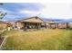 A well-manicured lawn in the backyard, accented with a playground at 4509 Westmere Ave, North Las Vegas, NV 89084