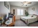 Well-lit bedroom with neutral colors, a large window, and furnishings at 4509 Westmere Ave, North Las Vegas, NV 89084