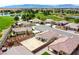 Aerial shot overlooking houses near a golf course and lake, blending residential and recreational appeal at 4571 S Via Roma Dr, Pahrump, NV 89061