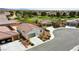 Aerial view of a neatly planned neighborhood with well-maintained homes and green spaces nearby at 4571 S Via Roma Dr, Pahrump, NV 89061