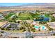 A community featuring a golf course, lakes, green spaces, a community pool and clubhouse at 4571 S Via Roma Dr, Pahrump, NV 89061