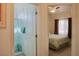 Bathroom with shower and bedroom views show the flow and size of this cozy space at 4571 S Via Roma Dr, Pahrump, NV 89061