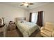 Cozy bedroom featuring a comfortable bed, soft carpet, and neutral decor at 4571 S Via Roma Dr, Pahrump, NV 89061
