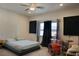 Bedroom showcasing neutral walls, fan, carpet, and natural light at 4571 S Via Roma Dr, Pahrump, NV 89061