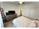 Spacious bedroom with dresser, queen bed, ceiling fan, and ample closet space at 4571 S Via Roma Dr, Pahrump, NV 89061