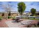 Serene community park features a picnic table area, mature trees, and well maintained landscaping at 4571 S Via Roma Dr, Pahrump, NV 89061