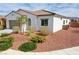 Attractive single-story home showcasing desert landscaping and a convenient two-car garage at 4571 S Via Roma Dr, Pahrump, NV 89061