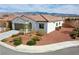 Inviting single-story home featuring desert landscaping, a neutral color palette, and a mountain view at 4571 S Via Roma Dr, Pahrump, NV 89061