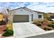 Charming single-story home featuring a well-manicured yard and a two-car garage, perfect for comfortable living at 4571 S Via Roma Dr, Pahrump, NV 89061