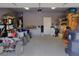 Spacious garage interior with ATVs, storage, and ample parking space at 4571 S Via Roma Dr, Pahrump, NV 89061