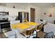 Open concept kitchen with stainless appliances, island and eat-in breakfast bar at 4571 S Via Roma Dr, Pahrump, NV 89061