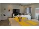 Open living area with casual seating and a view of the kitchen and backyard at 4571 S Via Roma Dr, Pahrump, NV 89061