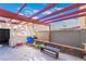 This backyard features a swing set, a covered patio, and ample space to enjoy the outdoors at 466 Las Casitas Way, Las Vegas, NV 89121