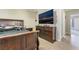 This bedroom includes a sleek entertainment center and a sizable television at 466 Las Casitas Way, Las Vegas, NV 89121