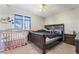 Bedroom featuring a full sized bed and neutral carpet at 466 Las Casitas Way, Las Vegas, NV 89121