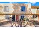 View of townhome featuring a stucco exterior with a well maintained yard at 466 Las Casitas Way, Las Vegas, NV 89121