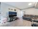 Cozy living room featuring gray walls and vinyl floors at 466 Las Casitas Way, Las Vegas, NV 89121