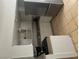 The kitchen has white cabinets, stainless steel appliances, and tile flooring at 4774 Lucite Ln, Las Vegas, NV 89115