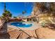 A backyard pool surrounded by patio stones with room for chairs and outdoor dining at 5277 Masters Ave, Las Vegas, NV 89142