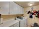 Functional laundry room with modern appliances and ample storage space at 60 Mesa Rivera St, Henderson, NV 89012