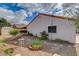 Backyard features desert landscaping, a storage shed, and view of the home's exterior at 630 Otono Dr, Boulder City, NV 89005