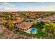A landscaped community with a beautiful home, pool, and manicured yard at 71 Fountainhead Cir, Henderson, NV 89052