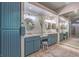 Stylish bathroom featuring double vanity, large mirror, and storage cabinet at 71 Fountainhead Cir, Henderson, NV 89052