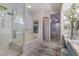 Bathroom showcasing walk-in shower, soaking tub, and vanity with sink at 71 Fountainhead Cir, Henderson, NV 89052