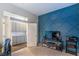 Bedroom with custom blue accent wall, closet, and shelving unit at 71 Fountainhead Cir, Henderson, NV 89052