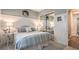 Charming bedroom with mirrored closet doors and a stylish accent wall for a relaxing retreat at 71 Fountainhead Cir, Henderson, NV 89052
