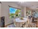 Bright dining area with large window offering beautiful views of the outdoors at 71 Fountainhead Cir, Henderson, NV 89052
