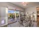 Bright dining room with sliding glass doors leading to outdoor patio and backyard at 71 Fountainhead Cir, Henderson, NV 89052