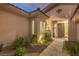 Welcoming front entrance with stone walkway, desert landscaping, and well-maintained facade at 71 Fountainhead Cir, Henderson, NV 89052