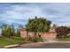 Charming single-story home featuring a well-manicured lawn and a two-car garage at 71 Fountainhead Cir, Henderson, NV 89052