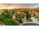 Stunning aerial view of a well-maintained home with beautiful landscaping and mountain views at 71 Fountainhead Cir, Henderson, NV 89052