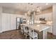 Spacious kitchen with white cabinetry, stainless steel appliances, and a large island at 71 Fountainhead Cir, Henderson, NV 89052