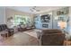 Inviting living room with a large window for natural light and backyard views at 71 Fountainhead Cir, Henderson, NV 89052