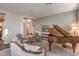 Elegant living room featuring a grand piano, stylish seating, and subtle decor at 71 Fountainhead Cir, Henderson, NV 89052