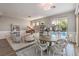 Open floorplan featuring living and dining areas with a piano and pool views at 71 Fountainhead Cir, Henderson, NV 89052