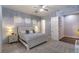 Well-lit main bedroom featuring neutral walls and carpet, with an ensuite bathroom at 71 Fountainhead Cir, Henderson, NV 89052