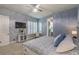 Spacious bedroom featuring ensuite bathroom, a television and a large bed at 71 Fountainhead Cir, Henderson, NV 89052
