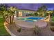 Beautiful backyard pool and spa with lush landscaping create a private oasis at 71 Fountainhead Cir, Henderson, NV 89052