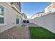 Private backyard with a paver patio, rock landscaping, and a patch of artificial grass at 7348 N Decatur Blvd # 5, Las Vegas, NV 89131