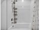 Bright bathroom with white subway tile, shower head and a bathtub at 7348 N Decatur Blvd # 5, Las Vegas, NV 89131