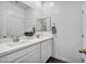 Bright bathroom with double sinks, white cabinetry, and a large mirror at 7348 N Decatur Blvd # 5, Las Vegas, NV 89131