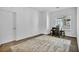 Large room that is decorated as a secondary bedroom, featuring carpet and a rug at 7348 N Decatur Blvd # 5, Las Vegas, NV 89131